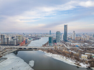 Fototapeta premium Yekaterinburg aerial panoramic view in spring at sunset. Yekaterinburg city and pond in spring or autumn.