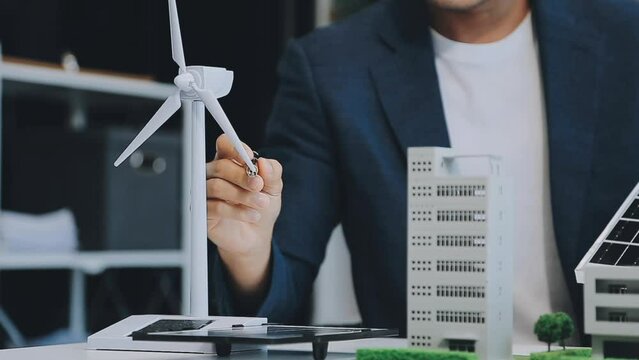 Diverse group of business people planning for alternative energy utilization for greener sustainable Earth by reducing CO2 emission and carbon credit with renewable clean energy technology. Quaint