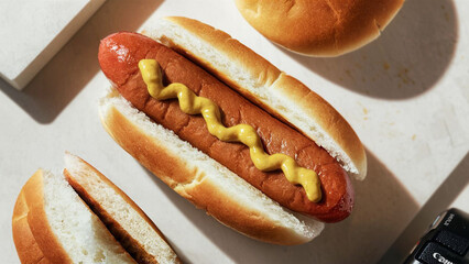 high angle view and close up shot from above, photo of hotdog with sausage and mustard sauce, graphic resource