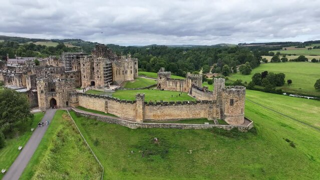 Drone Shot of Alnwick Castle, Medieval Landmark and Landscape of Northumberland, England UK 60fps