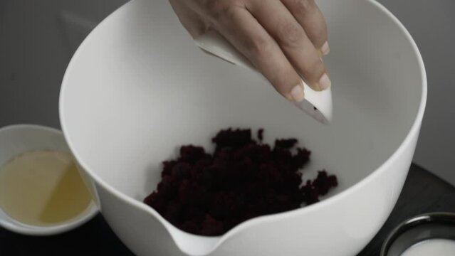 Adding beet pulp to make a white bowl as the base for beet pulp muffins cupcake vegan bake
