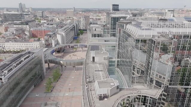 Aerial drone fly above landmark in Belgium Brussels European Parliament establishing shot at daylight, skyline neighborhood streets and buildings