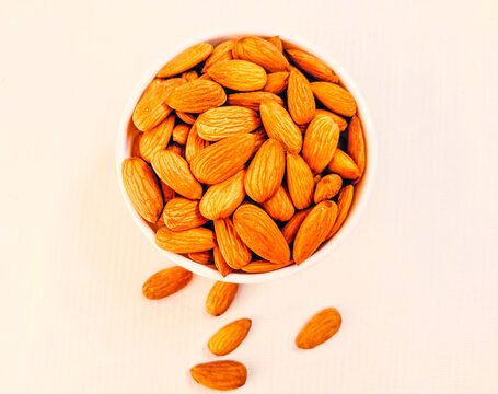 Almonds nuts in a bowl sweet almond nut  dry fruit food ingredient lauz badem amandel almendra badam closeup stock photo