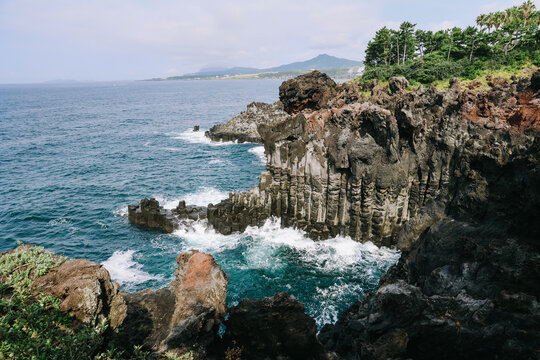 The Daepo Jusangjeolli (Jusangjeollidae) basalt columnar joints and cliffs at Jeju Island, South Korea.