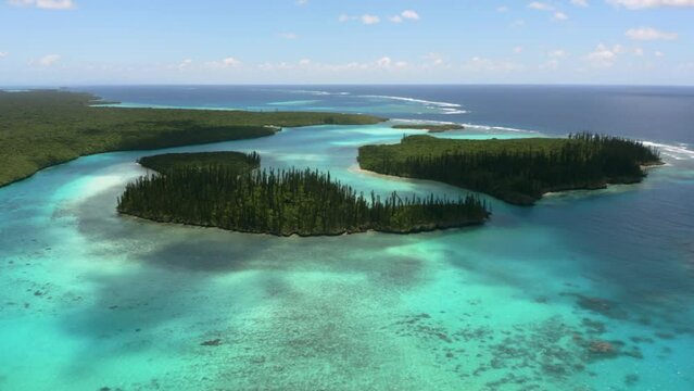 Establishing aerial view of beautiful Oro Bay, Isle of Pines, New Caledonia.