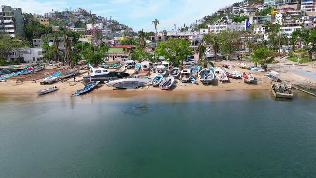 Aerial footage slowly moving away from Manzanillo Beach in Acapulco, revealing the aftermath of Hurricane Otis