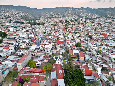 Horizontal aerial shot displaying the residential landscapes and colorful districts within Chilpancingo
