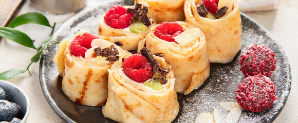 Asian sweet sushi pancake. Rolls with cream cheese berry and fruits.