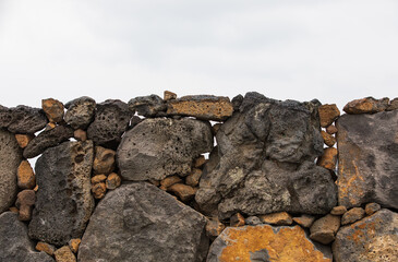 Jeju stone wall that forms the border of the field. Batdam