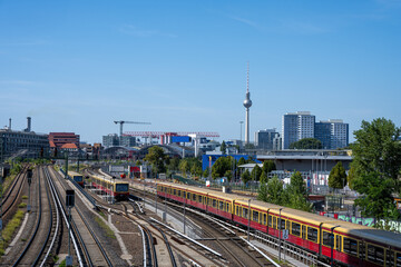 Local commuter trains in Berlin, Germany, with the famous TV Tower in the back
