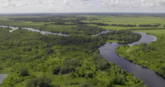 Aerial view of winding river in Farmland that connects to Lake Okeechobee in Florida