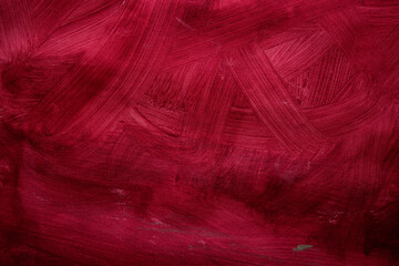 Acrylic red burgundy paint on canvas, modern art. Red paint texture brush strokes. Fragment of artwork, brushstrokes of paint. Contemporary art, colorful texture