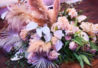 Decor for a wedding or engagement party. Close-up of floristry, flowers and decorative elements.