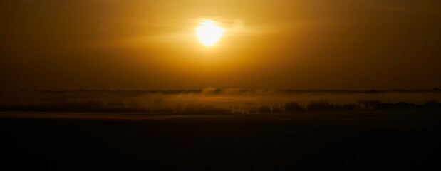 Obraz premium Beautiful landscape at sunrise. The forest is far away