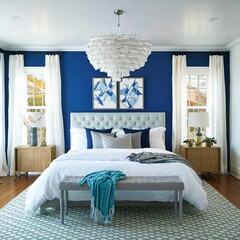 Stylish modern white and blue chandelier in trendy spacious bedroom with king size bed
