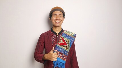 excited asian muslim man smiling and okay hand