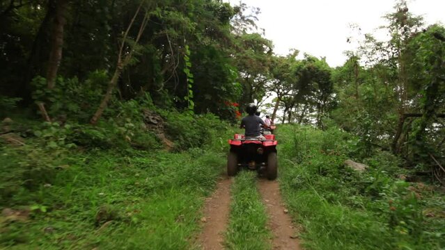 Following closely behind four-wheelers on Hawaiian road