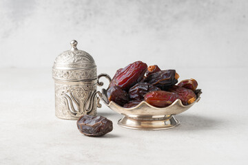 Dried delicious date fruit on vintage stone background	