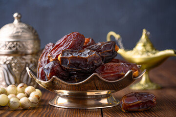 Dried delicious date fruit on wooden background	