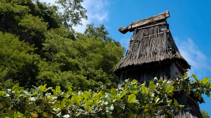 Traditional thatched roof Timorese cultural building at popular tourism landmark of Cristo Rei statue in capital city of Dili, Timor-Leste, Southeast Asia