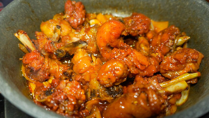 closeup of butter chicken cooking process, homemade recipe