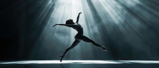 Ballet dancer in mid-performance under dramatic stage lights