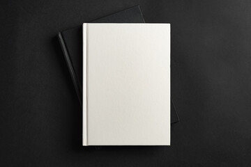 Hardcover book or notepad mock up on black background