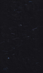 Handmade rice black paper texture with blue fibers for scrapbook.