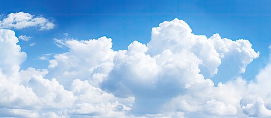 Naklejka na ściany i meble Dramatic Skyscape with Majestic Cloud Formation in a Vast Blue Sky