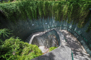 The tunnel's spiral walkway leads to a ground entering at Fort Canning Park in Singapore.