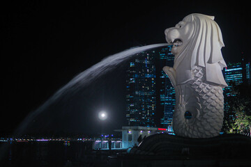 Singapore, Singapore - April 19, 2018 : Singapore's signature, the Merlion, with a background of...