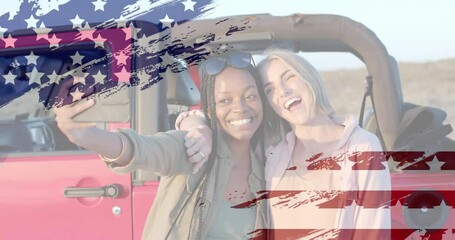 Animation of flag of usa over happy diverse women taking selfie by car on beach in summer - Powered by Adobe
