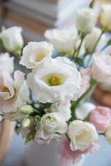 Small bouquet with white and pink eustoma in the interior
