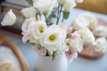 Small bouquet with white and pink eustoma in the interior