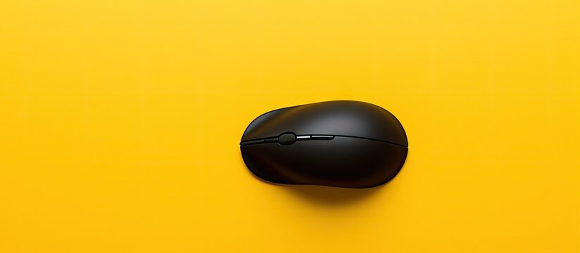 Modern Computer Mouse on Vibrant Yellow Surface - Concept of Technology and Innovation
