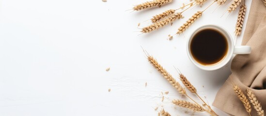 Rustic Charm: A Cozy Cup of Coffee Paired with Fresh Wheat Grains on a Clean White Background