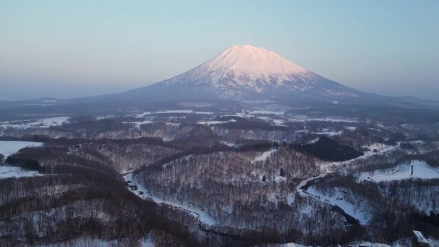 Niseko, Japan: Aerial drone footage of mount Yotei volcano near the Niseko ski resort the during winter in Hokkaido in northern Japan