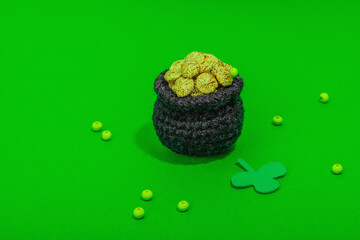 Handmade St. Patrick's Day concept. Traditional decorative symbols, pot with golden coins