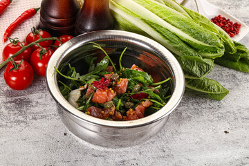 Salad with salmon and arugula