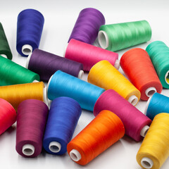 Thread spools background. Various colors sewing kit. Collection of threads. Vibrant vivid colors. Sew threads. Colorful hobby background.