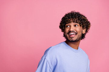 Fototapeta premium Photo portrait of nice young guy look interested excited empty space wear trendy blue outfit isolated on pink color background