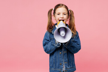 Little child kid girl 7-8 years old wearing denim shirt hold in hand megaphone scream announces...
