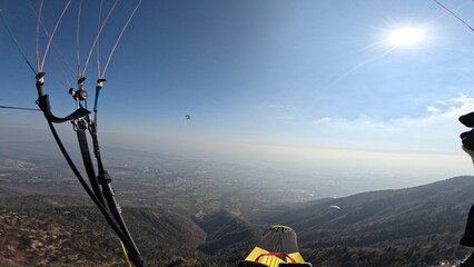 First Person Paragliding view. Paraglider in the mountains