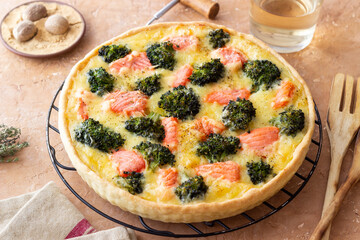 Quiche or pie with salmon and broccoli. French cuisine.