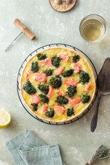 Quiche or pie with salmon and broccoli. French cuisine.