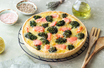 Quiche or pie with salmon and broccoli. French cuisine.