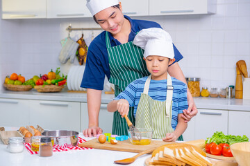 father and son cooking