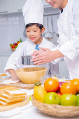father and son cooking