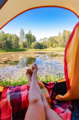 View of nature from a tent with girlish legs