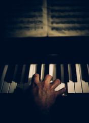 male hand on piano close-up